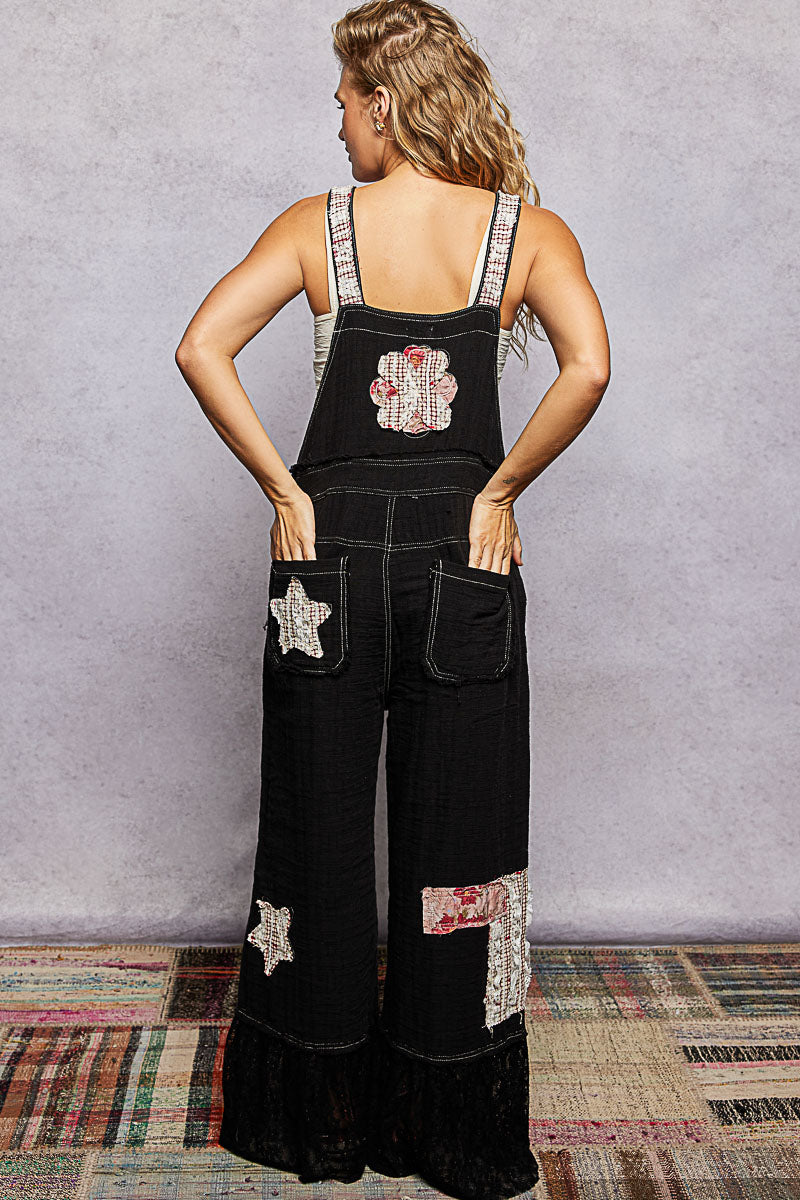 Black overalls with patches