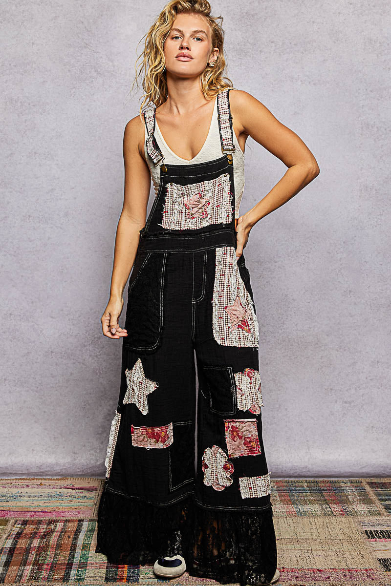 Black overalls with patches