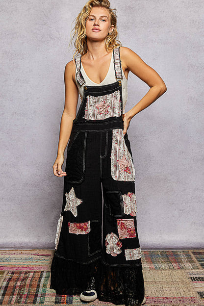 Black overalls with patches
