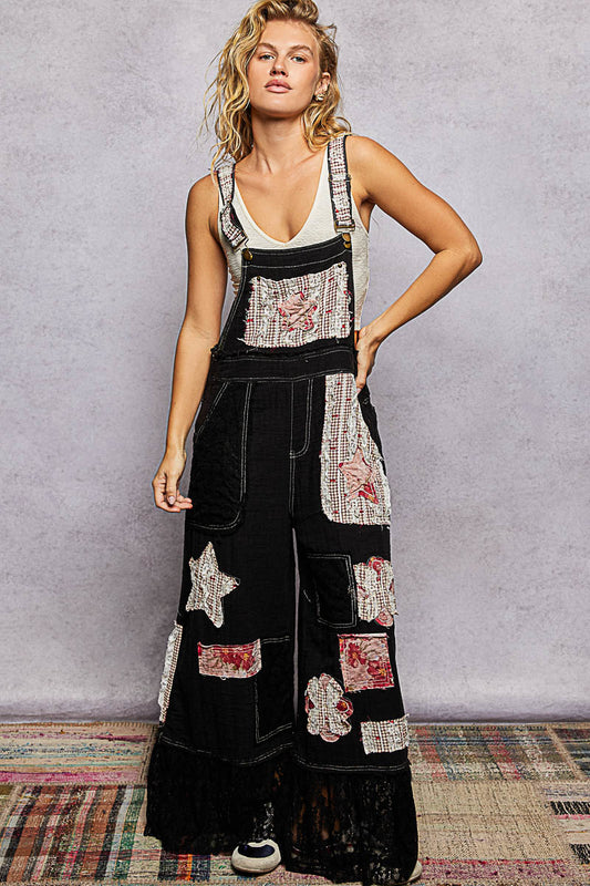 Black overalls with patches
