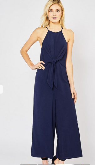NAVY High-neck jumpsuit featuring self-tie closure detail at waist. Zipper closure at back. Unlined. Non-sheer. Woven. Lightweight.
